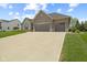 Charming home featuring a three-car garage, stone and brick facade, and well-manicured lawn at 3424 S Lookout Pass, New Palestine, IN 46163