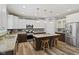 Bright kitchen with stainless steel appliances, granite countertops, and kitchen island with barstool seating at 3424 S Lookout Pass, New Palestine, IN 46163