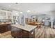 Open floor plan kitchen with kitchen island, granite countertops, and stainless steel appliances at 3424 S Lookout Pass, New Palestine, IN 46163
