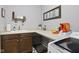 Functional laundry room featuring ample countertop space, wooden cabinetry, and modern washer and dryer at 3424 S Lookout Pass, New Palestine, IN 46163