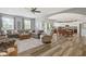 Inviting open-concept living room flows into the kitchen and features stylish decor and comfortable seating at 3424 S Lookout Pass, New Palestine, IN 46163