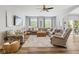 Spacious living room featuring a sectional sofa, modern decor, and plenty of natural light at 3424 S Lookout Pass, New Palestine, IN 46163
