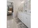 Bright main bathroom features a double vanity with white cabinets and granite countertops at 3424 S Lookout Pass, New Palestine, IN 46163