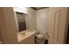 Bathroom featuring a sink with marble countertops, toilet, and shower with sliding door at 35 Meadow Dr, New Palestine, IN 46163