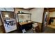 Dining area with seating around a dark wood dining table at 35 Meadow Dr, New Palestine, IN 46163