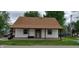 Charming single-story home with a brown roof, white siding, and a cozy front porch at 35 Meadow Dr, New Palestine, IN 46163