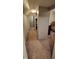 Hallway features carpeted floors leading to other rooms in the home at 35 Meadow Dr, New Palestine, IN 46163