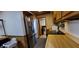 The kitchen features a stainless fridge, cooktop, and lots of storage at 35 Meadow Dr, New Palestine, IN 46163