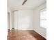 Bedroom with wood flooring, ceiling fan, closet and window at 3846 Alsace Pl, Indianapolis, IN 46226