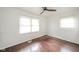 Bedroom with wood flooring, ceiling fan and two windows at 3846 Alsace Pl, Indianapolis, IN 46226