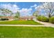 A well-kept single-story brick house with a green lawn and an adjacent driveway at 3846 Alsace Pl, Indianapolis, IN 46226