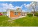 Charming brick home with a well-manicured lawn, patio area, and inviting curb appeal at 3846 Alsace Pl, Indianapolis, IN 46226