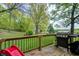 Back deck with wooded view and barbecue grill at 4080 S London Dr, Martinsville, IN 46151
