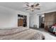 Comfortable bedroom with wood sliding door to the bathroom and closet at 4080 S London Dr, Martinsville, IN 46151