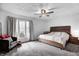 Cozy bedroom with natural light, ceiling fan, and a comfortable bed at 4080 S London Dr, Martinsville, IN 46151