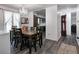 Bright dining room with a chandelier and dining set for eight people at 4080 S London Dr, Martinsville, IN 46151