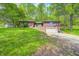 Exterior view of a brick home with an attached garage, situated on a lush lawn at 4080 S London Dr, Martinsville, IN 46151