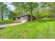 Brick home features a built in garage, a cozy deck, and landscaping at 4080 S London Dr, Martinsville, IN 46151