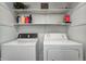 Laundry room featuring modern appliances and storage at 4080 S London Dr, Martinsville, IN 46151