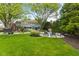 Expansive backyard with a pool and lounge chairs, perfect for summer relaxation at 4619 Allen Dr, Carmel, IN 46033