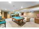Basement with a pool table, seating area, and wet bar, offering a great space for recreation and relaxation at 4619 Allen Dr, Carmel, IN 46033