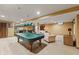 Finished basement with a pool table and bar area with plenty of space for entertaining guests at 4619 Allen Dr, Carmel, IN 46033