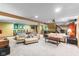 Spacious finished basement featuring a pool table, seating area, and bar, perfect for entertaining guests at 4619 Allen Dr, Carmel, IN 46033