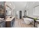 Bathroom featuring a soaking tub, double vanity, and wood-look flooring at 4619 Allen Dr, Carmel, IN 46033