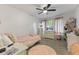 Cozy bedroom with pink accents, ceiling fan, and lots of space at 4619 Allen Dr, Carmel, IN 46033