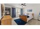 Bright bedroom with a wooden bed frame, blue accents, and a window nook with natural light at 4619 Allen Dr, Carmel, IN 46033