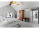 Bright bedroom with vaulted ceilings, ceiling fan, a large window, and warm wood furniture offering a comfortable ambiance at 4619 Allen Dr, Carmel, IN 46033