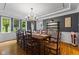 Elegant dining room with dark gray walls, chandelier, and large window at 4619 Allen Dr, Carmel, IN 46033