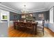 Formal dining room features a large wooden table with seating for ten at 4619 Allen Dr, Carmel, IN 46033