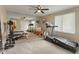 Exercise room with carpet, window, mirror wall, and ceiling fan at 4619 Allen Dr, Carmel, IN 46033