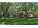 Charming two-story home with a well-manicured lawn and mature trees in a peaceful, established neighborhood at 4619 Allen Dr, Carmel, IN 46033