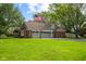 Charming home exterior with a manicured lawn and a spacious three-car garage at 4619 Allen Dr, Carmel, IN 46033