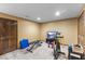 Finished basement with workout equipment and lots of space for activities at 4619 Allen Dr, Carmel, IN 46033