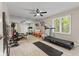 Home gym featuring mirrored wall, a treadmill, and other exercise equipment at 4619 Allen Dr, Carmel, IN 46033