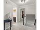 Upstairs hallway with gray carpet leading to multiple rooms at 4619 Allen Dr, Carmel, IN 46033