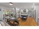 Eat-in kitchen boasts an island, white cabinets, modern appliances, and a view to the patio at 4619 Allen Dr, Carmel, IN 46033