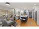 Modern kitchen boasts white cabinetry, blue island, stainless steel appliances, and a sunroom view at 4619 Allen Dr, Carmel, IN 46033
