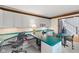 Bright home office with a wrap-around desk, offering an ideal space for productivity and organization at 4619 Allen Dr, Carmel, IN 46033