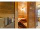 Wood-paneled sauna featuring built-in benches and a serene environment for relaxation at 4619 Allen Dr, Carmel, IN 46033