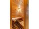 Close-up of a sauna with wood panels, bench seating, and a calming, spa-like ambiance at 4619 Allen Dr, Carmel, IN 46033