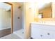 Bathroom with white vanity, walk-in shower, and neutral tile at 4632 Willowbrook Dr, Columbus, IN 47203