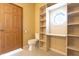 Bathroom featuring built-in shelving, tiled floors, and custom window at 4632 Willowbrook Dr, Columbus, IN 47203