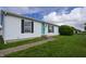 Charming single-story home featuring a well-maintained lawn, vinyl siding, and a welcoming front entrance at 4632 Willowbrook Dr, Columbus, IN 47203