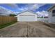 Detached garage with a wide concrete driveway, providing ample parking and storage in a well-maintained setting at 4632 Willowbrook Dr, Columbus, IN 47203