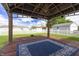 Relaxing gazebo with a cozy outdoor rug, perfect for enjoying serene backyard views on a wooden deck at 4632 Willowbrook Dr, Columbus, IN 47203