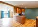 Kitchen featuring wood floors, cabinets and stainless steel fridge at 4632 Willowbrook Dr, Columbus, IN 47203